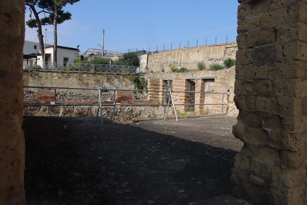 II.1 Herculaneum, October 2023.
Looking south-west across room through doorway in south-west corner of atrium. Photo courtesy of Klaus Heese.